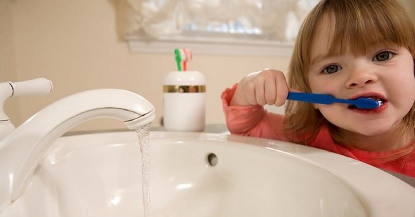 girl brushing teeth