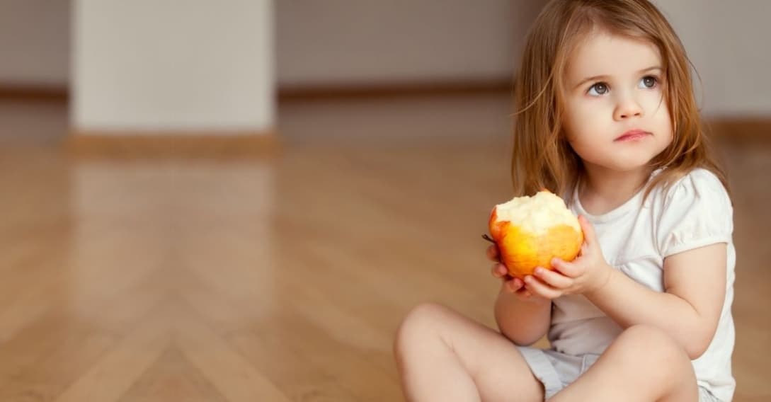 child with apple