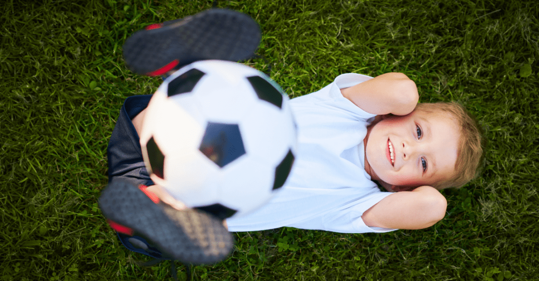 child lying on lawn