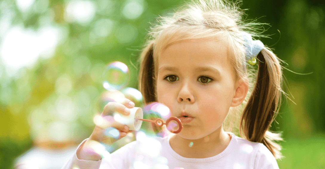 Child blowing bubbles