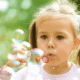 Child blowing bubbles