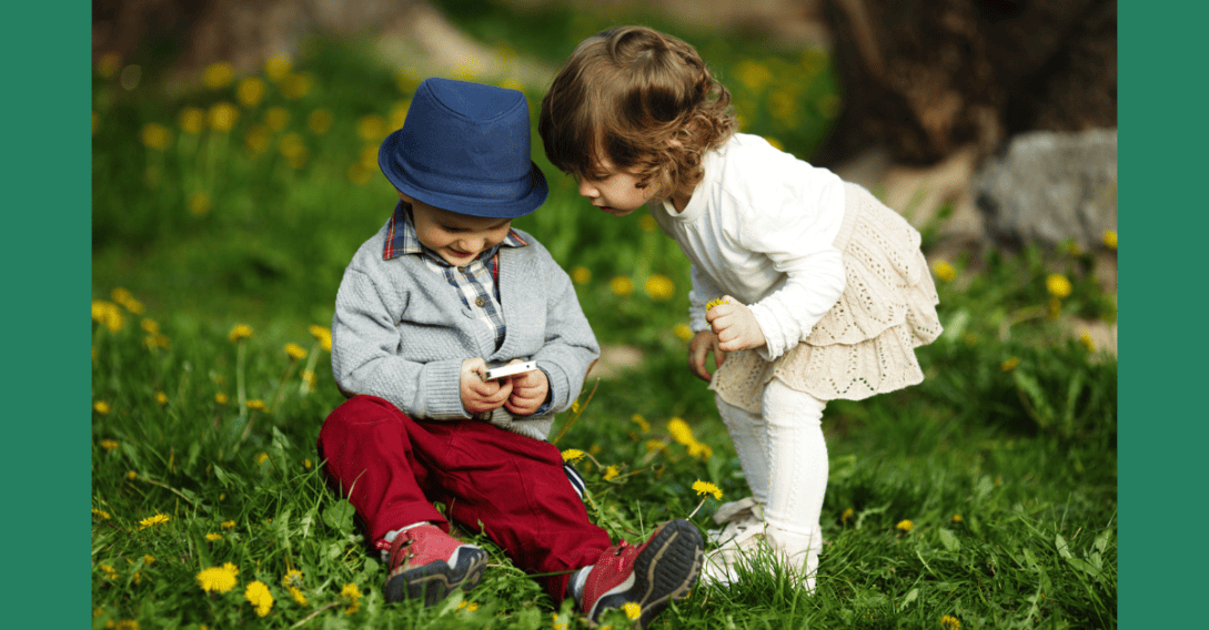 children in nature with cell phone